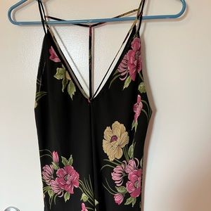 Timing large sleeveless black top with floral design